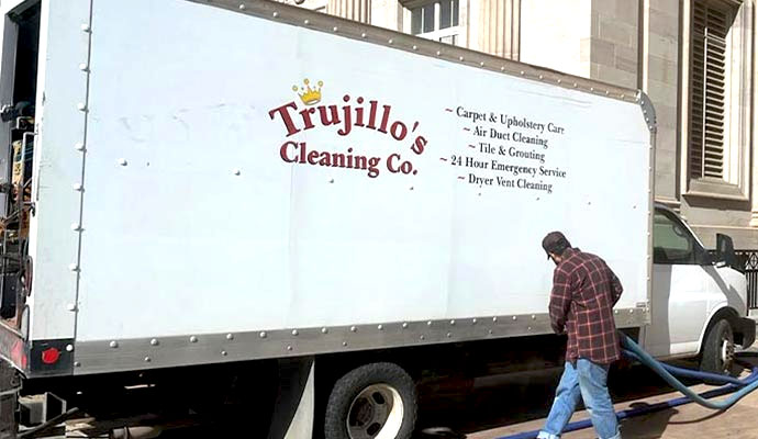 Trujillos cleaning co service truck with technician and hoses