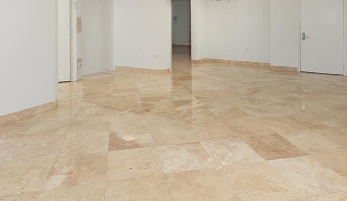 Clean and shiny travertine floor in interior space