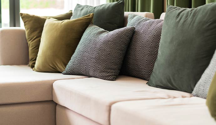 Clean and organized seat cushions on a living room sofa