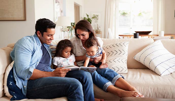 Family relaxing on clean couch