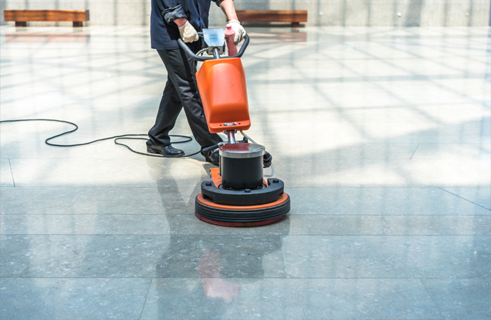 worker cleaning floor