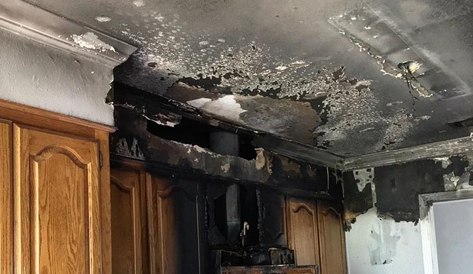 Fire-damaged ceiling and wooden property