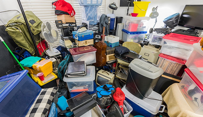 Heavily cluttered room requiring hoarding cleanup