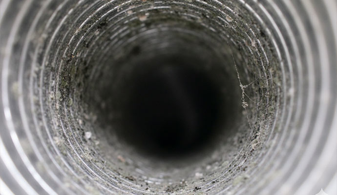 Inside of a dirty HVAC air duct