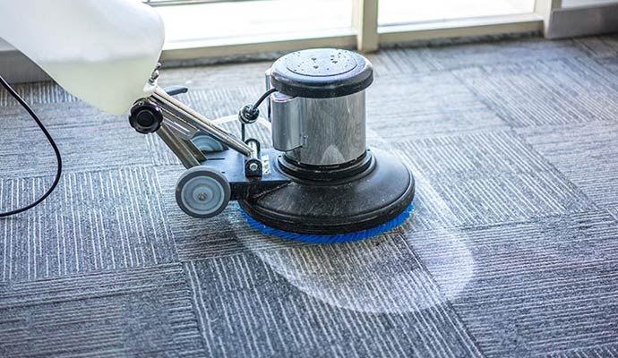 Professional carpet shampoo machine on commercial carpet