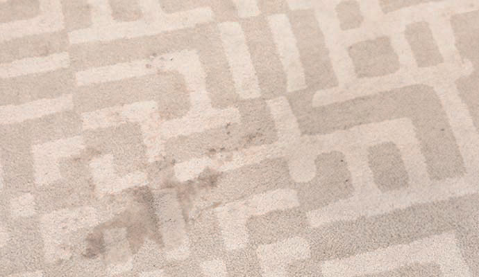 Stained patterned concrete patio and odor