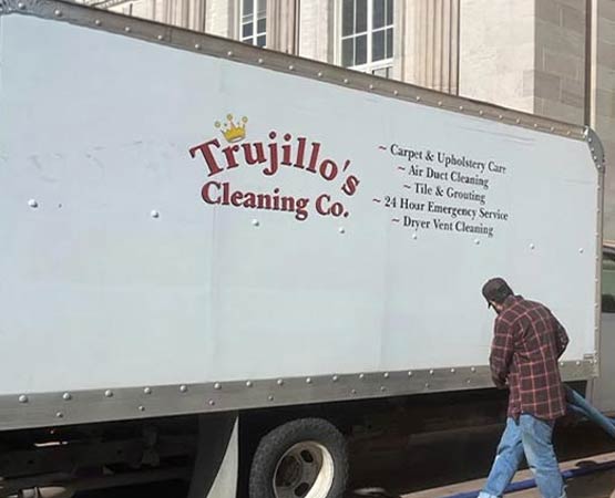 A Trujillo's Cleaning Co. service truck parked on-site