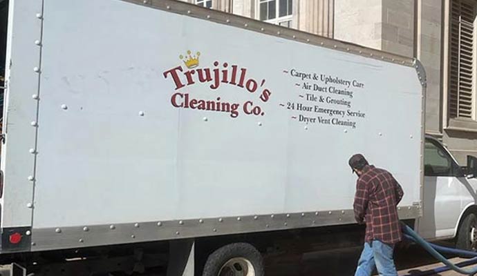 A Trujillo's Cleaning Co. service truck parked on-site