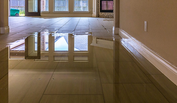 Standing water inside a residential home after flooding