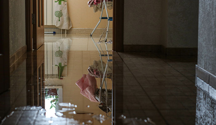 Water covering a floor from a plumbing leak